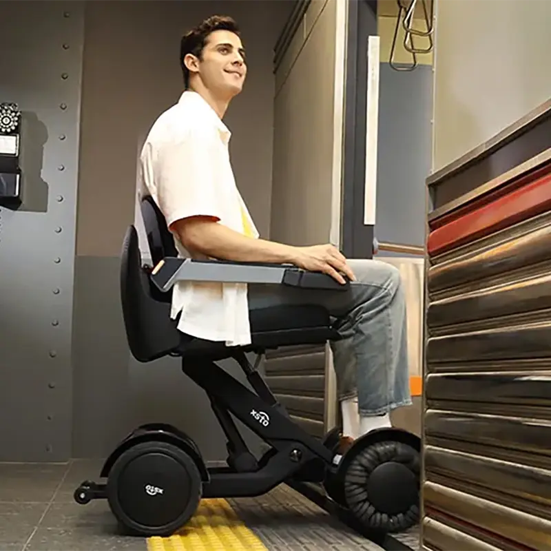 Person using a Mobility World Ltd UK: XSTO M4 Electric Powered Wheelchair in an indoor setting