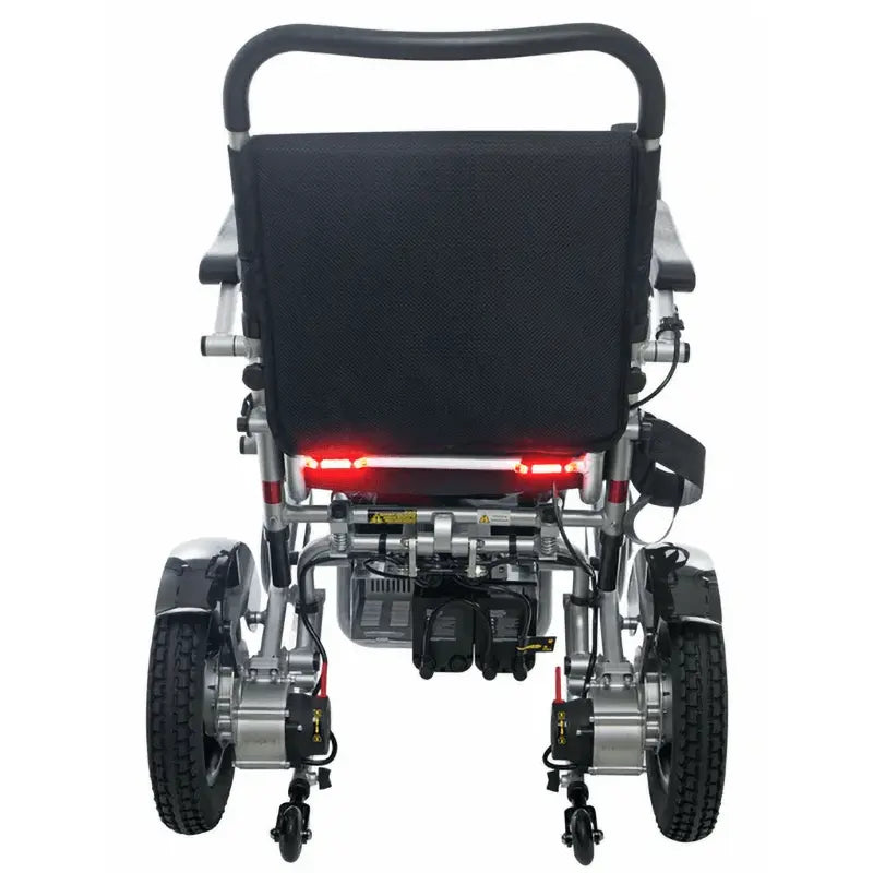 Experience the ultimate in mobility with the Ergofold Elite folding electric wheelchair. Its advanced motors, controller, and up to three batteries provide unmatched performance and range. The tension back and seat, flip-up armrests, seat belt, and 10cm cushion all contribute to a comfortable and secure ride. Plus, the white and red reflectors and 12 inch pneumatic rear wheels ensure stability and safety. With one-step quick folding, this wheelchair is perfect for those on the go.