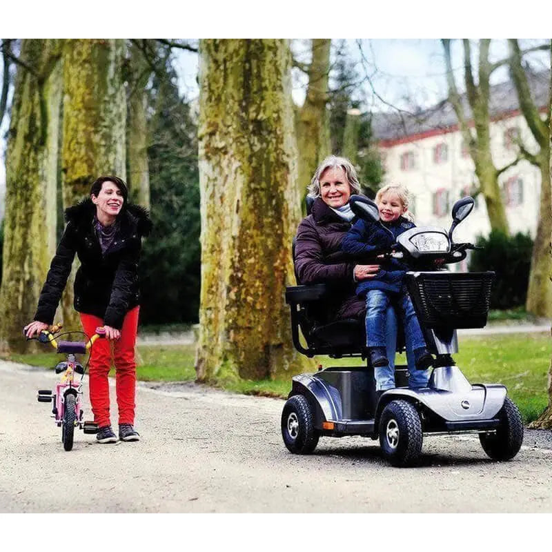 The S425 is faster, stronger, and lasts longer than its smaller sibling, delivering more power! It has bright LED lights, all-around suspension, and a top speed of 8mph, making it acceptable for both road and pavement use. Its taller wheels (30cm) make navigating outside barriers simple. Do you need to go further? The bigger 55Ah battery will keep you running. Plus, its unique carbon-metallic colour is sure to turn heads!