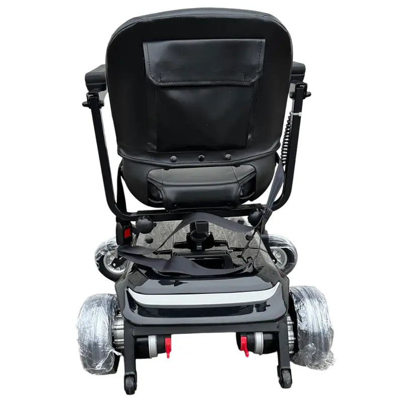 The MobilityPlus+ Quick-Split Electric Wheelchair is a compact, lightweight powerchair with a 60cm turning circle, perfect for everyday use. It easily dismantles into four pieces for effortless transport and storage, with the heaviest part weighing just 15.2kg. Features include a height-adjustable, padded swivel seat, flip-up armrests for easy transfers, and a user-friendly joystick. Travel up to 11 miles at speeds of 4mph, with added safety from electromagnetic brakes and an adjustable seatbelt. Ideal for