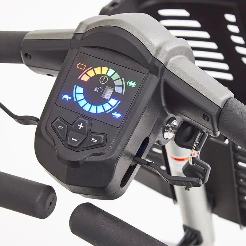 The Motion Healthcare Aura builds on the Airium's success, offering a lightweight aluminium frame (15.5kg) and a 2.6kg lithium battery with a 21-mile range. Features include pneumatic tyres, front/rear suspension, an adjustable swivelling captain's seat with flip-up armrests, and a digital LCD control panel with a front light, indicators, and adjustable delta tiller. It disassembles into six parts for easy transport, making it ideal for various terrains and travel.