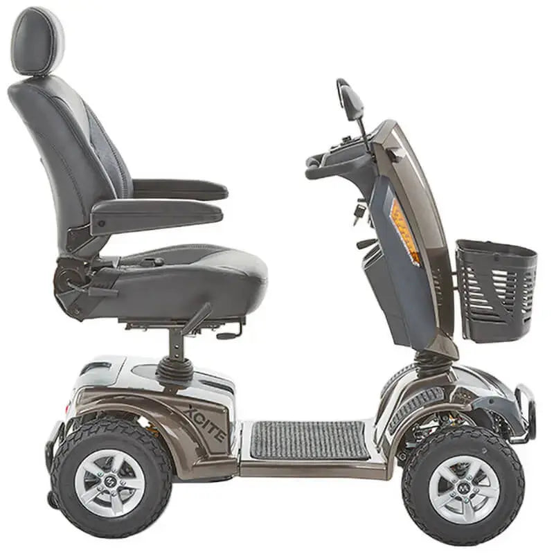 The Motion Healthcare Xcite Li Mobility Scooter offers a 45-mile range and 8 mph top speed with safe lithium phosphate batteries. It features large wheels, suspension, a padded Captain's seat, and an adjustable tiller.  Ideal for all terrains, it includes lights, indicators, a horn, and high ground clearance, supporting up to 25 stone. Additional conveniences are a storage basket and USB charging port.  The Xcite Li combines modern styling, ease of use, and robust performance for all journeys.