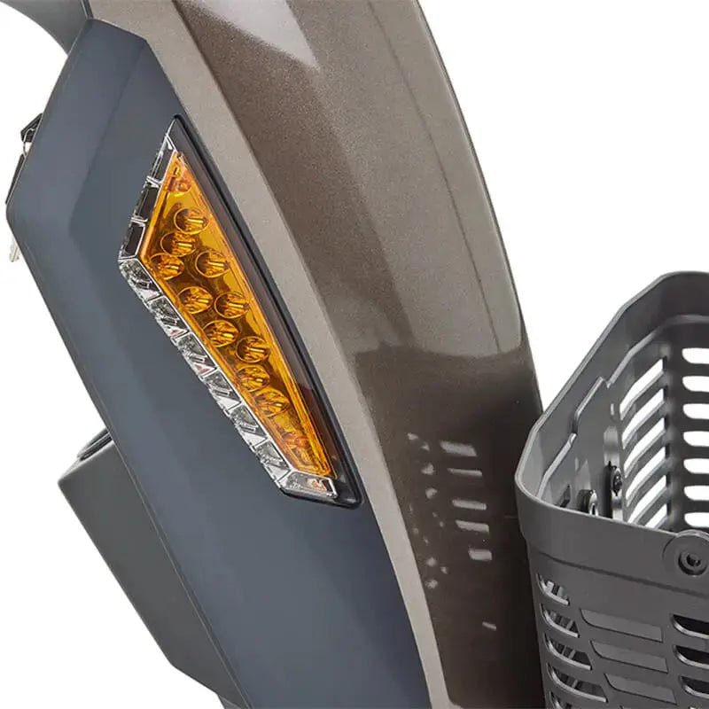 The Motion Healthcare Xcite Li Mobility Scooter offers a 45-mile range and 8 mph top speed with safe lithium phosphate batteries. It features large wheels, suspension, a padded Captain's seat, and an adjustable tiller.  Ideal for all terrains, it includes lights, indicators, a horn, and high ground clearance, supporting up to 25 stone. Additional conveniences are a storage basket and USB charging port.  The Xcite Li combines modern styling, ease of use, and robust performance for all journeys.