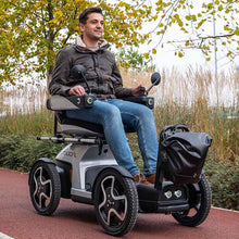 Load image into Gallery viewer, Mobility-World-Ltd-UK-TGA-Scoozy-Mobility-Scooter-and-Electric-Wheelchair-Lifestyle