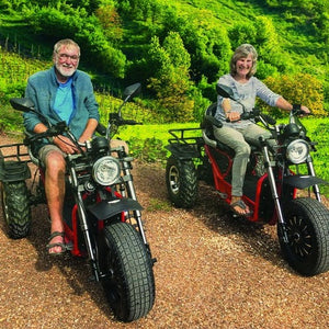 elder-couple-red-black-Mobility-world-invader-off-road-mobility-scooter-uk