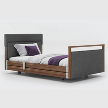 Load image into Gallery viewer, Opera Signature Upholstered Profiling Bed With Cot Sides &amp; Memory Mattress. The padded head and footboard design ensure&#39;s a comfortable and elegant finish. With height adjustment and full profiling features, this care bed is suitable for almost all user types.