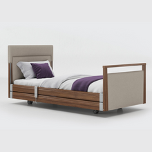 Load image into Gallery viewer, Opera Signature Upholstered Profiling Bed With Cot Sides &amp; Memory Mattress. The padded head and footboard design ensure&#39;s a comfortable and elegant finish. With height adjustment and full profiling features, this care bed is suitable for almost all user types.