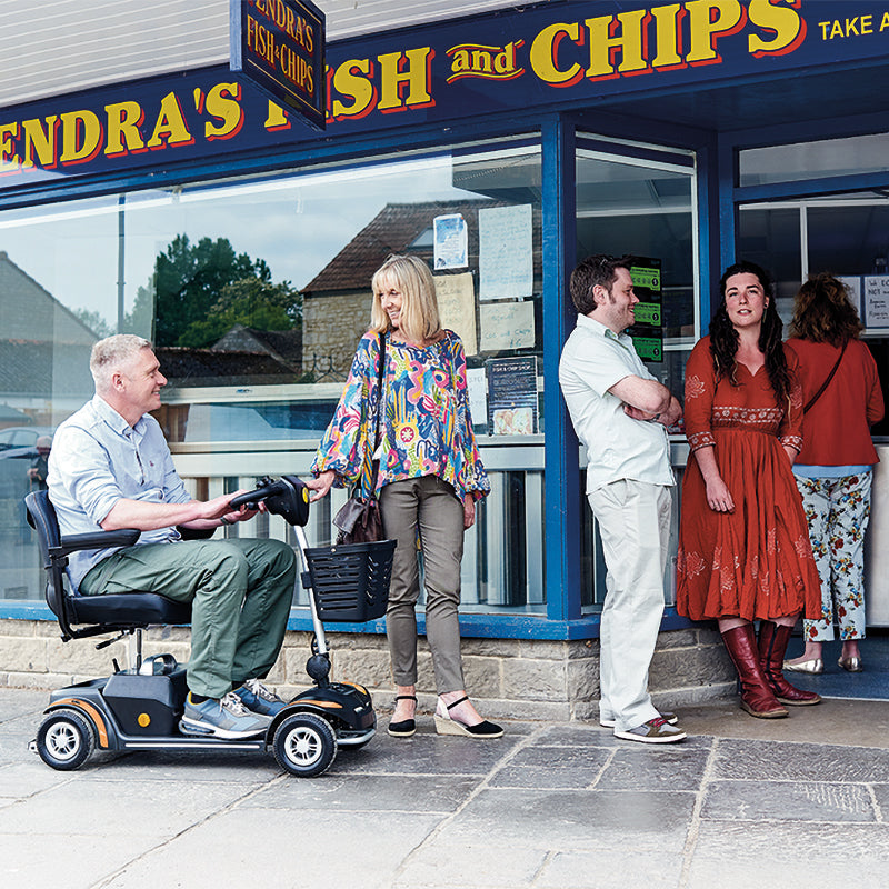 Mobility-World-Ltd-Rascal-Vierra-LiFe-Lifetime-Battery-Guarantee-Orange-outside-fish-_-chip-shop