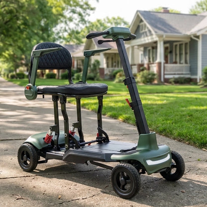 Green Smarti Plus Lightweight Auto-Folding Mobility Scooter on a driveway in front of a house