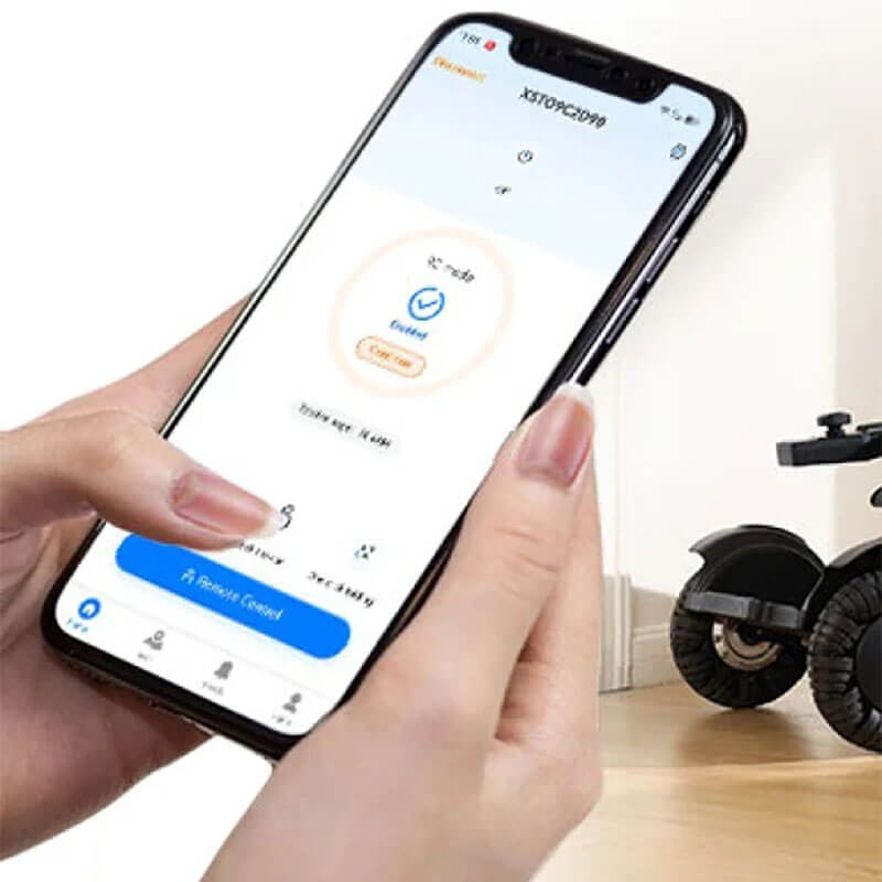 Hand holding a smartphone with an app interface displayed, showing control options for XSTO M4 Pro Smart Self Balancing Powered Wheelchair.