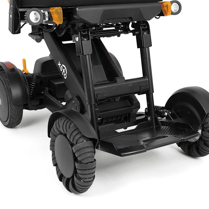 Close-up of XSTO M4 Pro Smart Self Balancing Powered Wheelchair Foot Pedal Height Adjustment with visible branding on a white background