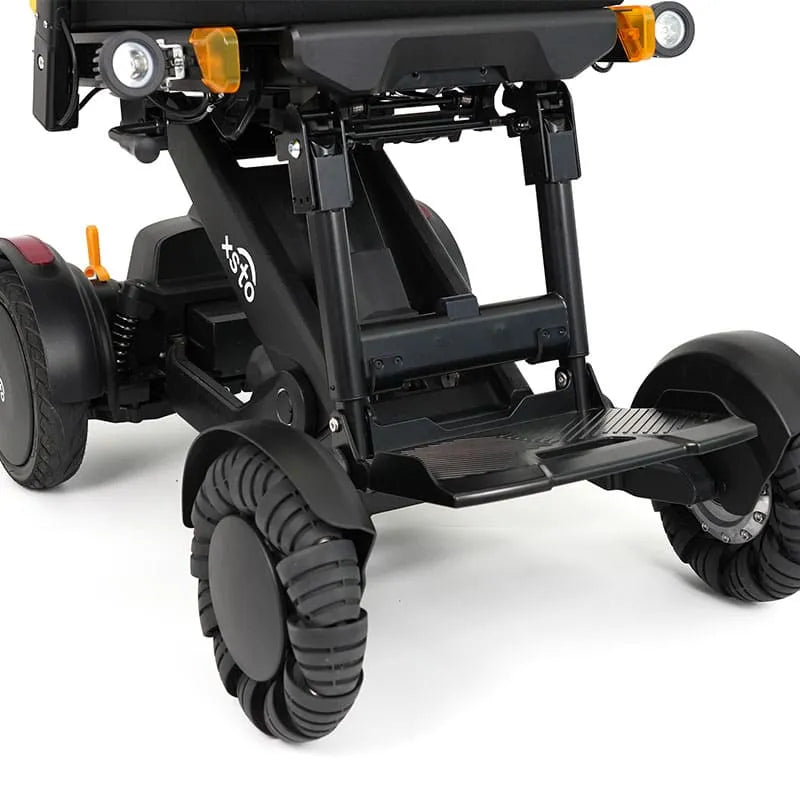 Close-up of XSTO M4 Pro Smart Self Balancing Powered Wheelchair foot foot pedal height adjustment with visible branding on a white background