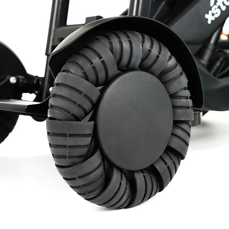 Close-up ofXSTO M4 Pro Smart Self Balancing Powered Wheelchair wheel with tread pattern on a white background