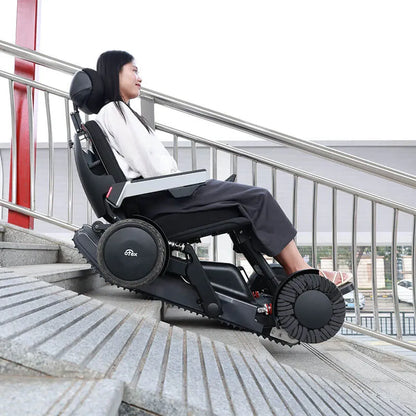 Person using a Xsto X12 All-Terrain Mobility Robot Powered Wheelchair
 to ascend stairs outdoors.