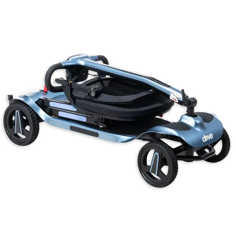 Folded AeroMg Lightweight Folding Mobility Scooter on a white background