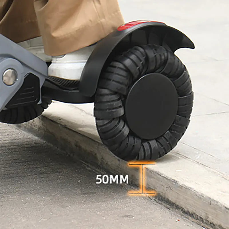 Close-up of an XSTO M4 Electric Powered Wheelchair wheel with a 50MM measurement label, used for climbing stairs.