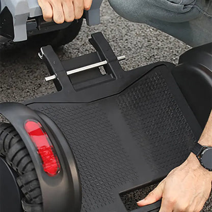 Close-up of a person using XSTO M4 Electric Powered Wheelchair with a focus on the seat and footrest.