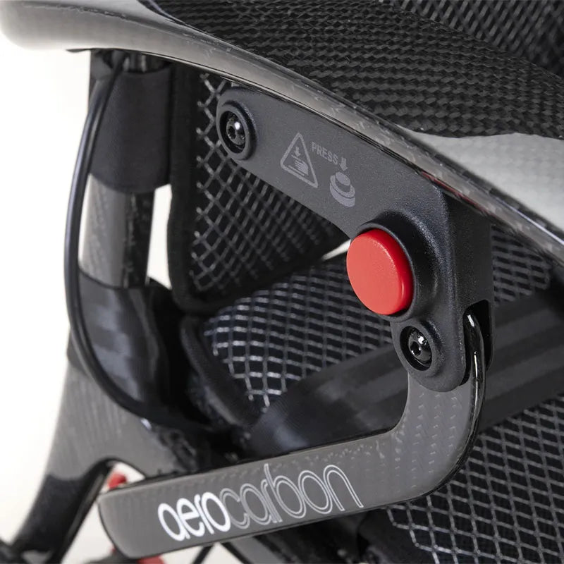 Close-up of a black AeroCarbon Carbon Fibre Folding Powerchair Wheelchair seat with a red button and 'aero carbon' branding.