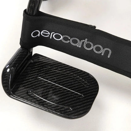close up AeroCarbon Carbon Fibre Folding Powerchair Wheelchair foot plate on a white background
