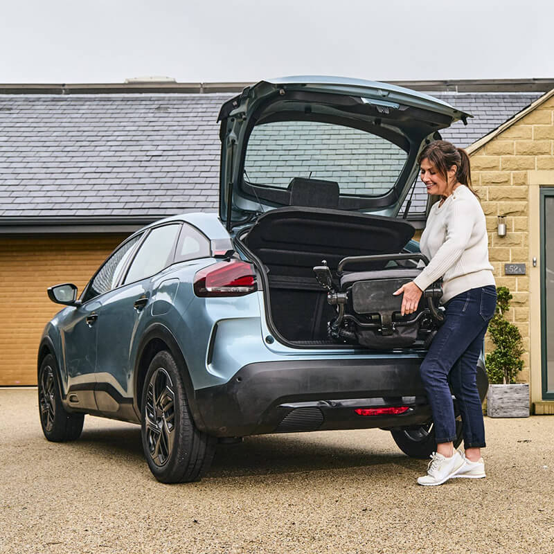 Photon Lite Compact Electric Folding Powerchair Lifting Inside the Chair