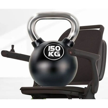 Black kettlebell with '150 KG' label on a Robooter E80 Ultra Carbon Fiber Lightweight Folding Powerchair