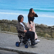 Load image into Gallery viewer, mobility_world_ltd_uk_quickie_q50_r_carbon_folding_powerchair_lifestyle