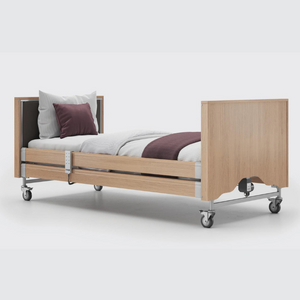 This profiling bed has the functionality of the Classic, with an upholstered inlay in the head and foot board, in a choice of fabrics.