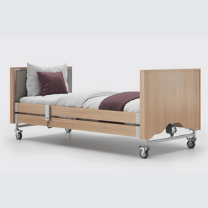 This profiling bed has the functionality of the Classic, with an upholstered inlay in the head and foot board, in a choice of fabrics.