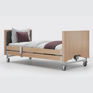 This profiling bed has the functionality of the Classic, with an upholstered inlay in the head and foot board, in a choice of fabrics.