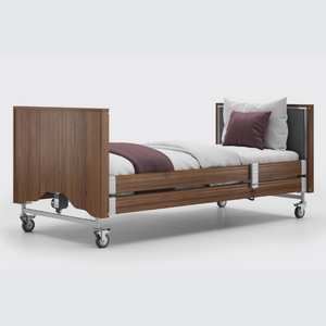 This profiling bed has the functionality of the Classic, with an upholstered inlay in the head and foot board, in a choice of fabrics.