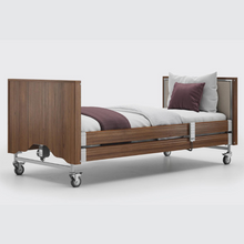 Load image into Gallery viewer, This profiling bed has the functionality of the Classic, with an upholstered inlay in the head and foot board, in a choice of fabrics.