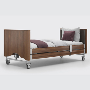 This profiling bed has the functionality of the Classic, with an upholstered inlay in the head and foot board, in a choice of fabrics.