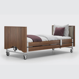 This profiling bed has the functionality of the Classic, with an upholstered inlay in the head and foot board, in a choice of fabrics.