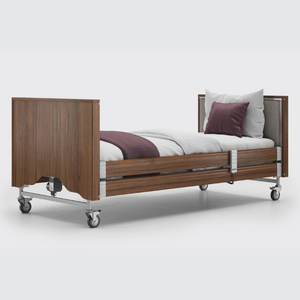 This profiling bed has the functionality of the Classic, with an upholstered inlay in the head and foot board, in a choice of fabrics.