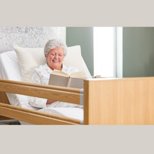 Load image into Gallery viewer, The Opera Enclosed 3ft Classic Profiling Bed With Cot Sides is perfect for those who need a little bit of extra help when it comes to getting in and out of bed. The bed can be raised to a nursing height of 80cm, making it easy for carers to provide assistance.