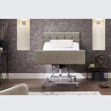 Load image into Gallery viewer, The Opera Signature Comfort Profiling Bed is the ultimate care bed for operators and users wanting to achieve a homely care environment. The bed has a fully upholstered surround and has headboard, fabric and width options.