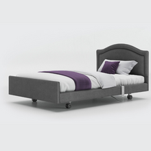 Load image into Gallery viewer, The Opera Signature Comfort Profiling Bed is the ultimate care bed for operators and users wanting to achieve a homely care environment. The bed has a fully upholstered surround and has headboard, fabric and width options.