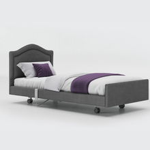 Load image into Gallery viewer, The Opera Signature Comfort Profiling Bed is the ultimate care bed for operators and users wanting to achieve a homely care environment. The bed has a fully upholstered surround and has headboard, fabric and width options.