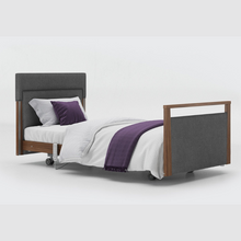 Load image into Gallery viewer, The Opera® Signature Upholstered is height adjustable for nursing and access. The bed has an extensive height range that allows it to be lowered close to the floor and raised to a carer&#39;s waist level.