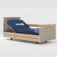 Load image into Gallery viewer, Opera Signature Upholstered Profiling Bed With Cot Sides. The padded head and footboard design ensure&#39;s a comfortable and elegant finish. With height adjustment and full profiling features, this care bed is suitable for almost all user types.