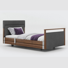 Load image into Gallery viewer, Opera Signature Upholstered Profiling Bed With Cot Sides. The padded head and footboard design ensure&#39;s a comfortable and elegant finish. With height adjustment and full profiling features, this care bed is suitable for almost all user types.