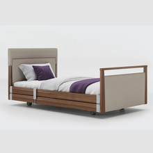 Load image into Gallery viewer, Opera Signature Upholstered Profiling Bed With Cot Sides. The padded head and footboard design ensure&#39;s a comfortable and elegant finish. With height adjustment and full profiling features, this care bed is suitable for almost all user types.