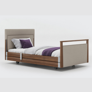 Opera Signature Upholstered Profiling Bed With Cot Sides. The padded head and footboard design ensure's a comfortable and elegant finish. With height adjustment and full profiling features, this care bed is suitable for almost all user types.