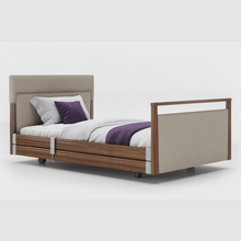 Load image into Gallery viewer, Opera Signature Upholstered Profiling Bed With Cot Sides. The padded head and footboard design ensure&#39;s a comfortable and elegant finish. With height adjustment and full profiling features, this care bed is suitable for almost all user types.