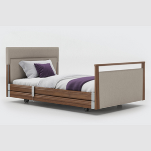 Opera Signature Upholstered Profiling Bed With Cot Sides. The padded head and footboard design ensure's a comfortable and elegant finish. With height adjustment and full profiling features, this care bed is suitable for almost all user types.