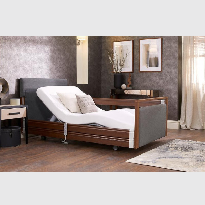 Opera Signature Upholstered Profiling Bed With Cot Sides & Memory Mattress. The padded head and footboard design ensure's a comfortable and elegant finish. With height adjustment and full profiling features, this care bed is suitable for almost all user types.