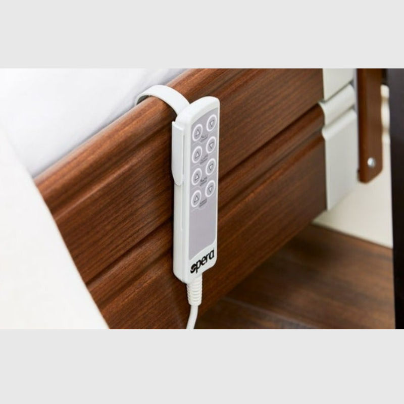 Opera Signature Upholstered Profiling Bed With Cot Sides & Memory Mattress. The padded head and footboard design ensure's a comfortable and elegant finish. With height adjustment and full profiling features, this care bed is suitable for almost all user types.