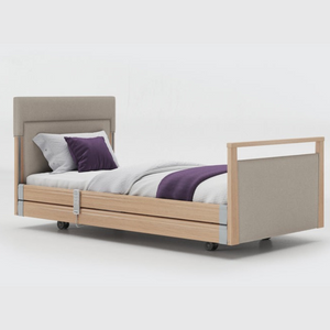 Opera Signature Upholstered Profiling Bed With Cot Sides & Memory Mattress. The padded head and footboard design ensure's a comfortable and elegant finish. With height adjustment and full profiling features, this care bed is suitable for almost all user types.