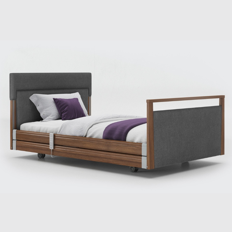Opera Signature Upholstered Profiling Bed With Cot Sides & Memory Mattress. The padded head and footboard design ensure's a comfortable and elegant finish. With height adjustment and full profiling features, this care bed is suitable for almost all user types.