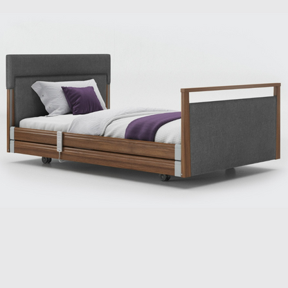 Opera Signature Upholstered Profiling Bed With Cot Sides & Memory Mattress. The padded head and footboard design ensure's a comfortable and elegant finish. With height adjustment and full profiling features, this care bed is suitable for almost all user types.